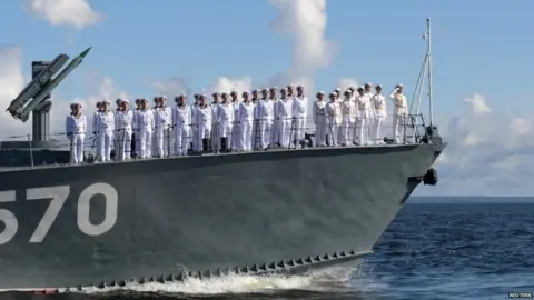 Reuters Russian sailors lined up onboard a small missile ship