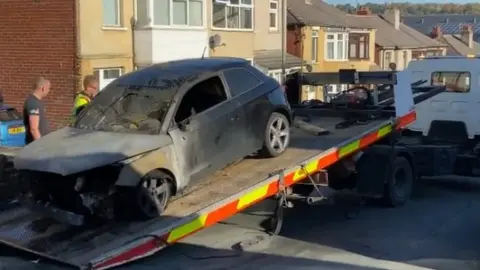 YappApp Burnt out car at the scene