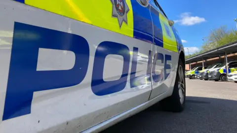 A Police car ready to deploy on a sunny day