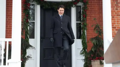 Reuters Canada's Prime Minister Justin Trudeau walks, ahead of speaking to reporters to announce he intends to step down as Liberal Party leader, but he will stay on in his post until a replacement has been chosen, from his Rideau Cottage residence in Ottawa, Ontario, Canada