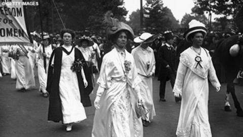 Christabel, Emmeline and Sylvia Pankhurst, lead a suffragette parade through London.