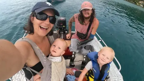 Craig Wood Mr Wood pictured with his fiancee Renata and their two children