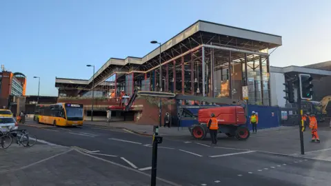 A photograph of the outside of the Eagle Market where work is taking place