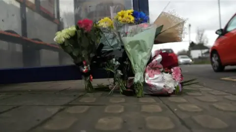 Flowers at a bus stop