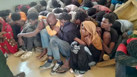 Social media A still image of foreign captives being held by the army in Sudan - April 2024