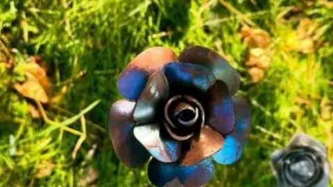  Green Vision Photography Rose made of steel on grass