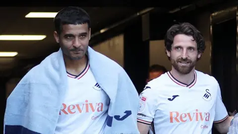 Kyle Naughton and Joe Allen after their final appearances for Swansea