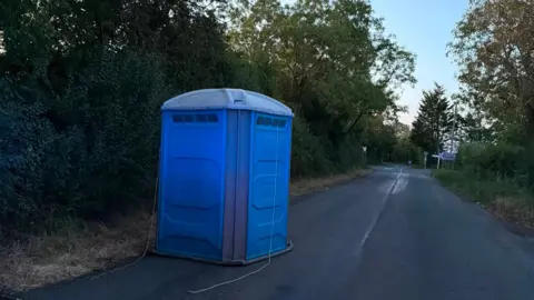 Portaloo blocking a road near Lutterworth