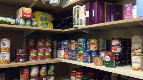 Cans of food on a shelf