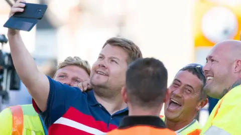 Getty James Corden, who plays Smithy, spotted posing with fans for a selfie during filming for the Gavin and Stacey Christmas special