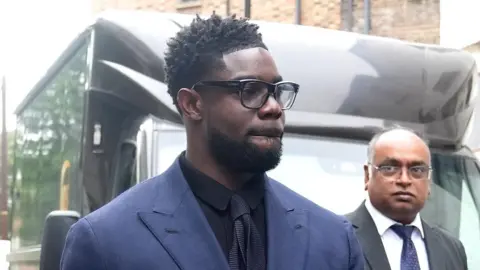 PA Media Micah Richards arriving at court on Friday