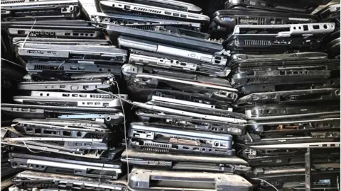 Getty Images Piles of discarded laptop computers