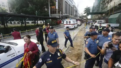 EPA Philippines police and private security secure the vicinity of the Resorts World Manila hotel and casino complex in Pasay City, south of Manila, Philippines 2 June 2017.