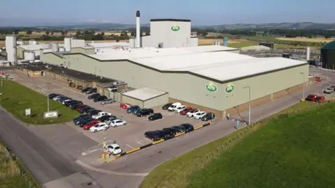 Arla Foods An aerial view of the Lockerbie dairy facility shows a large industrial building with a car park to the front