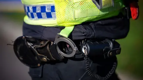 A stock photo of a police officer's handcuffs.