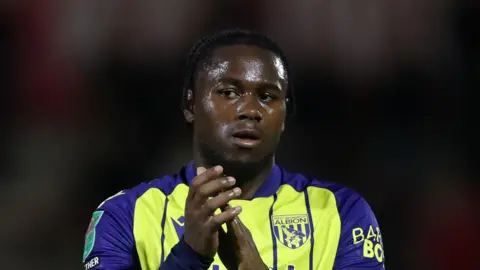 Reyes Cleary clapping West Brom supporters at the end of a Carabao Cup match