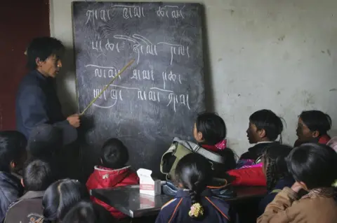 Getty Images Tibetan students attend a Tibetan language class at the Wanquan Primary School at the Yanshiping Township on July 7, 2006 in Yanshiping Township, Amdo County of Tibetan Autonomous Region, China.