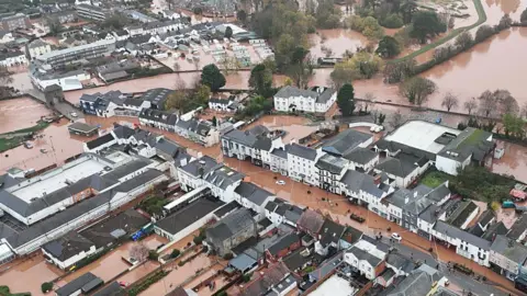 BBC Ariel view of Monmouth. Brown water flooding the town