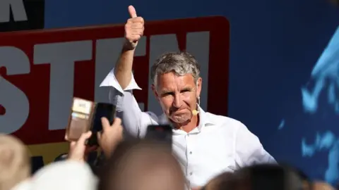 Reuters Bjorn Höcke, leader of the Alternative for Germany (AfD) in Thuringia, gestures during a campaign rally for the Thuringian state elections, August 29, 2024, in Nordhausen, Germany.