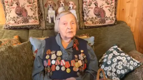 Zinaida Korneva/YouTube Russian war veteran Zinaida Korneva raises money for Covid-19 victims on YouTube