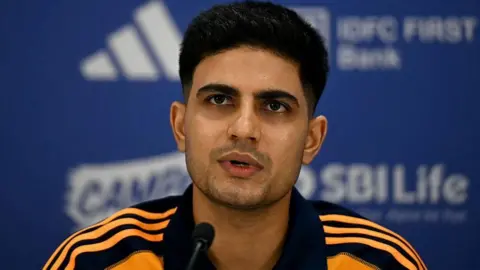 Indian cricket captain Shubman Gill addresses a pre-departure presser at the Board of Control for Cricket in India (BCCI) headquarters in Mumbai on June 5, 2025, ahead of India's tour of England for Test series. 