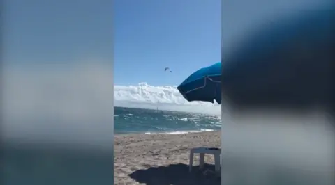 Paraglider falling almost 500ft into the ocean