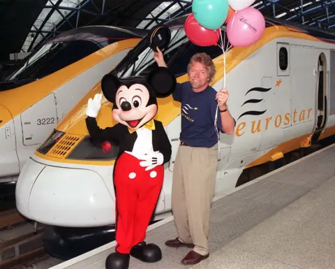 PA Media Virgin boss Richard Branson posed with Mickey Mouse