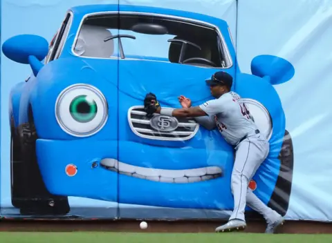 Kelley L Cox-USA TODAY Sports / Reuters Detroit Tigers left fielder Justyn-Henry Malloy tries to catch the ball in front of a car painting