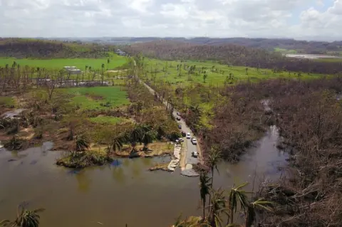 Getty Images Many interior roads are still heavily damaged, as officials prioritised mending coastal roads