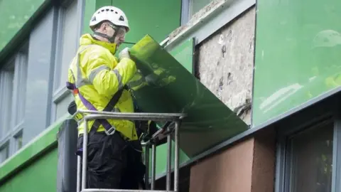 PA Cladding is removed from Hanover tower block in Sheffield, Yorkshire