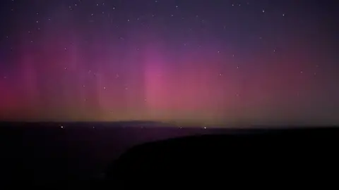 Jo Shreeves Pink glow in the sky at Portreath beach