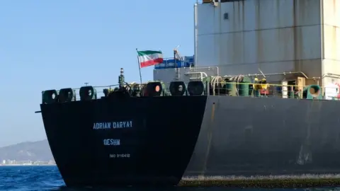 AFP In this file photo taken on August 18, 2019 an Iranian flag flutters on board the Adrian Darya oil tanker, formerly known as Grace 1, off the coast of Gibraltar.