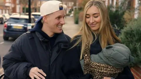 Hulu Jamie Laing and Sophie Habboo carrying a baby