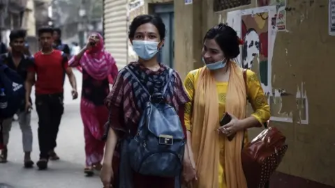 EPA People walking in Dhaka, Bangladesh on 31 March 2021