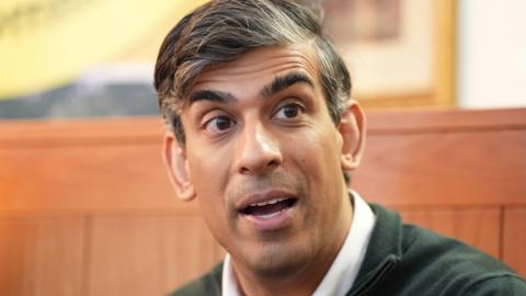 Close up of Rishi Sunak's face as he speaks during a neighbourhood watch meeting at a pub in Horsham, West Sussex