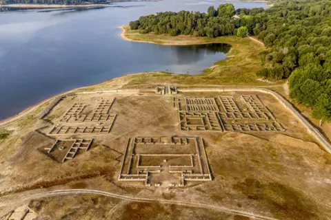 EPA-EFE/Shutterstock A view of the Roman camp Aquis Querquennis, located on the banks of the Limia river in the As Conchas reservoir, in Ourense, Spain, 10 August 2022.