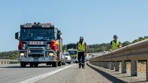 Reuters A handout image shows emergency workers in Australia searching for a radioactive capsule along a road