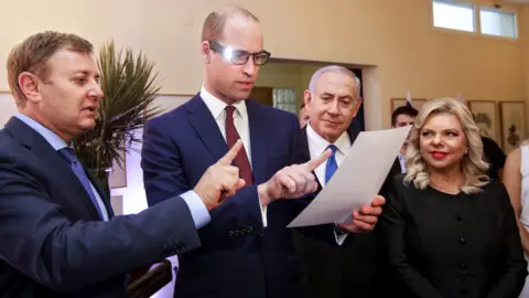 Getty Images Ziv Aviram (left) with Prince William and Benjamin Netanyahu