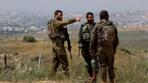 Reuters israeli troops near gaza border