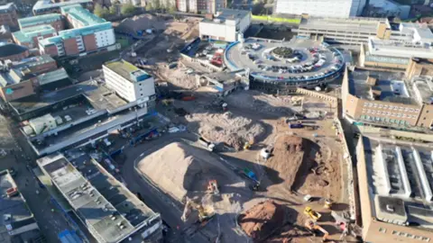 Drone footage of a building site in Coventry city centre, showing excavation work that is under way