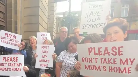 Gemma Dillon/BBC Protestors outside the Town Hall, Huddersfield