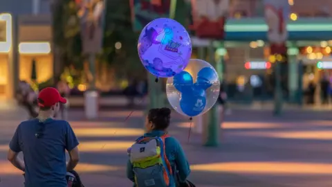 Getty Images Visitors as Disney's California theme park