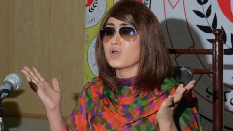 Getty Images Qandeel Baloch speaks to the media in Pakistan in 2016