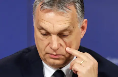 EPA Hungarian Prime Minister Viktor Orban scratches his cheek as he attends a press conference at the end of the European People's Party (EPP) on 20 March