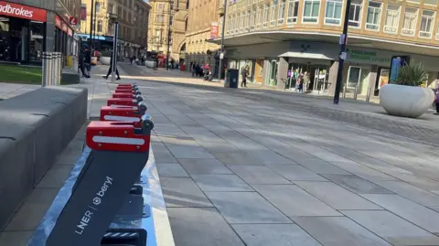 LDRS Red and grey e-bike docking stations on a street in Bradford