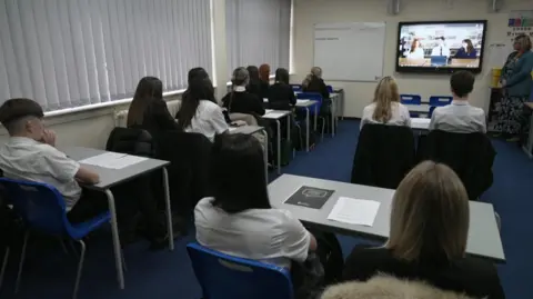 BBC Classroom of students sat at desks watching a video