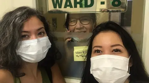 Sita Tyasutami A picture of Sita and Ratri visiting their mother while she was in hospital