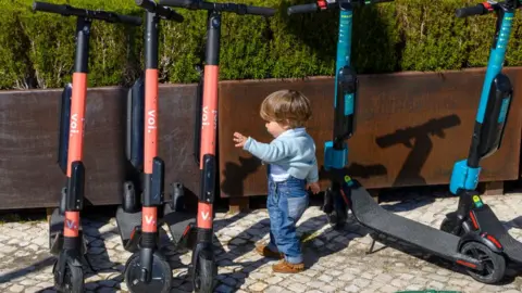 Getty Images Child with e-scooters