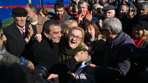 AFP Supporters of the defendants celebrate after the verdict is announced