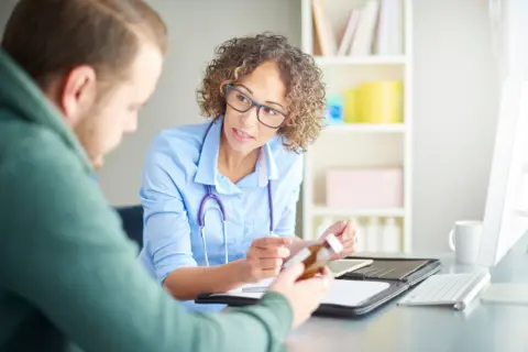 Getty Images Doctor speaking to patient (file image)